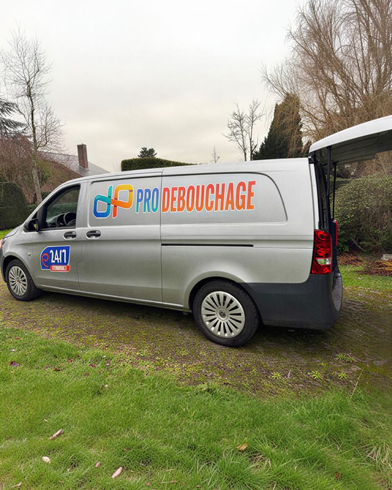 The Pro Débouchage van, rear doors open, ready for the job.
